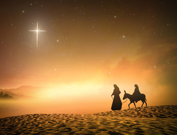 İsa'nın doğuşu Noel kavramı: siluet hamile Meryem ve yusuf yıldızın bir eşek ile çapraz arka plan. - Fotoğraf, Görsel