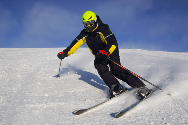 Skier skiing downhill in high mountains at Bolchoi Voudyavr, Kirovsk, Murmansk Oblast, Russia - Фото, зображення