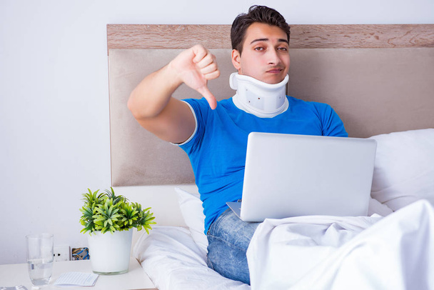 Young man with neck injury in the bed - Photo, Image