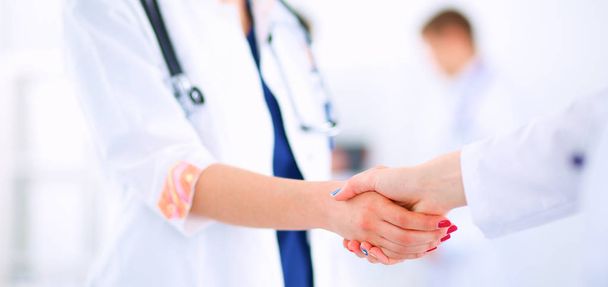 Young medical people handshaking at office - Foto, Imagen