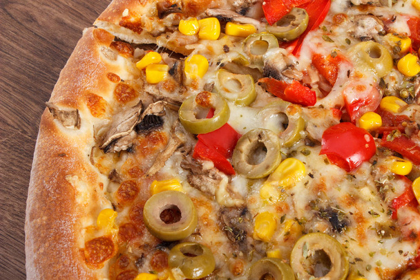 Vegetarian pizza on rustic board, fast food - Photo, Image