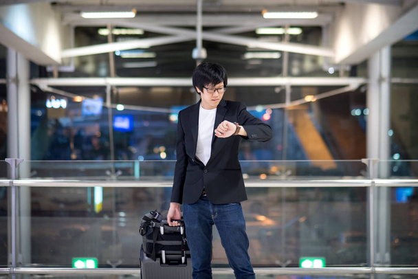 Young asian man waiting for the flight in airport - Photo, Image