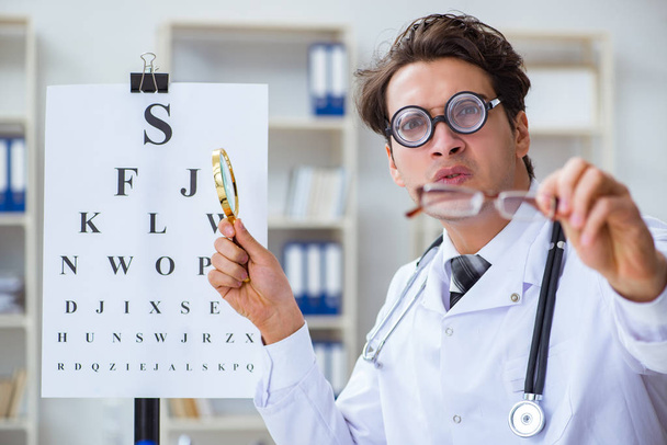 Funny eye doctor in humourous medical concept - Photo, Image