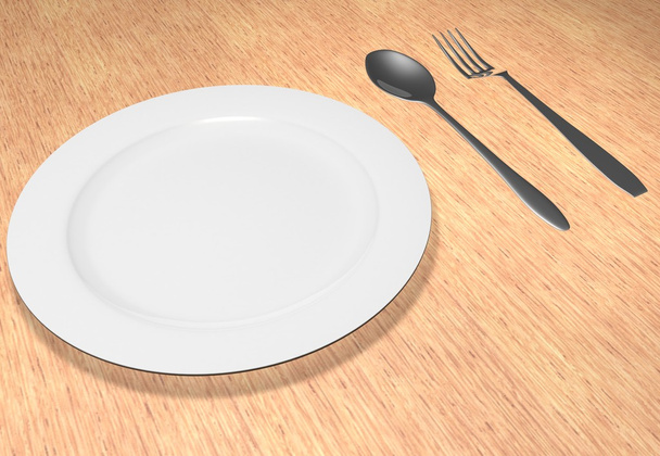 The fork and spoon lie near a plate - Fotó, kép