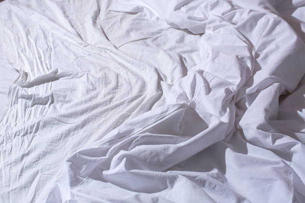 a crumpled white bed - Fotó, kép