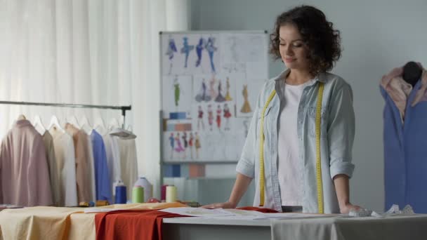 Inspired female seamstress imagine sketch of future dress, creative workshop - Video, Çekim