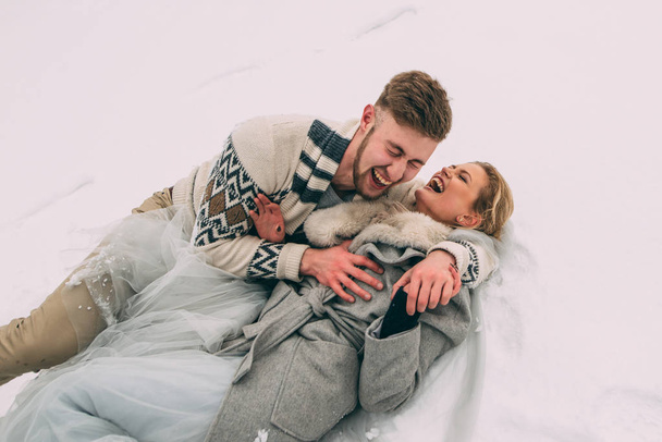 Photo of happy man and woman outdoor in winter - Fotografie, Obrázek
