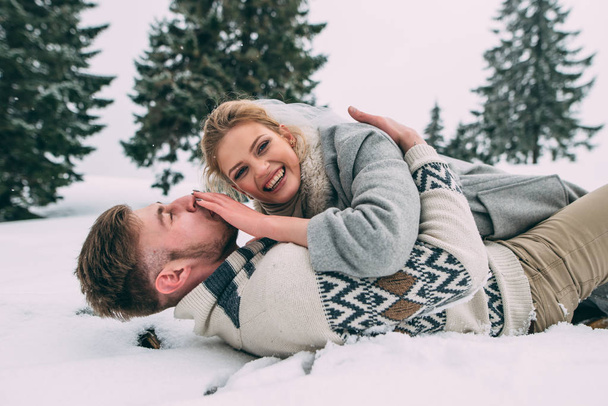 Photo of happy man and woman outdoor in winter - Фото, зображення