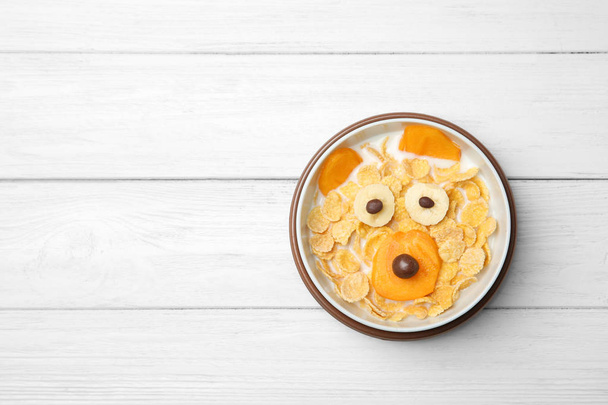 Creative breakfast for children on wooden background, top view - Φωτογραφία, εικόνα