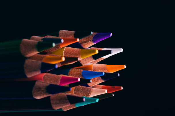 macro shot of colorful pencils isolated on black background in studio - Фото, зображення