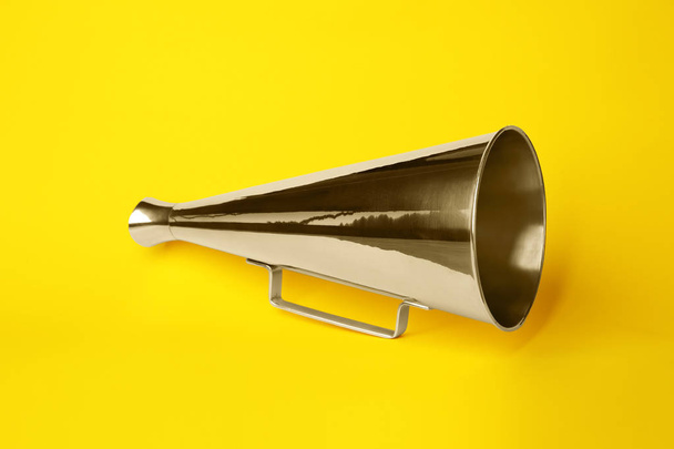 Vintage megaphone on color background - Valokuva, kuva