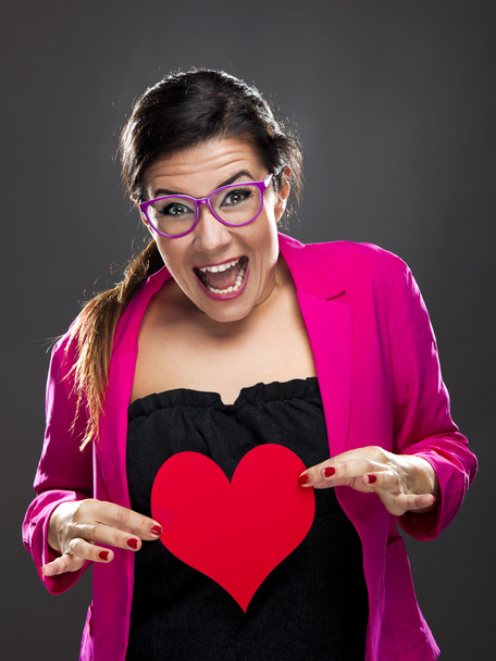 Funny woman holding a heart - Фото, изображение