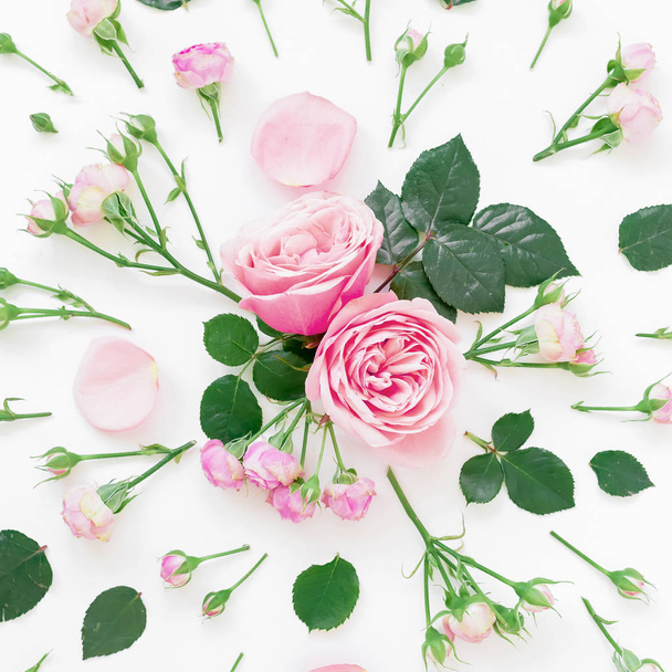 Floral pattern with pink roses on light background. Flat lay, Top view.  - Fotó, kép