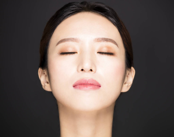 closeup asian beauty face isolated on black background - Photo, Image