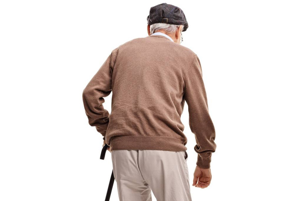 Rear view shot of a senior with a walking cane isolated on white background - Zdjęcie, obraz