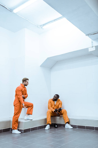 multiethnic prisoners in light modern prison cell - Photo, Image