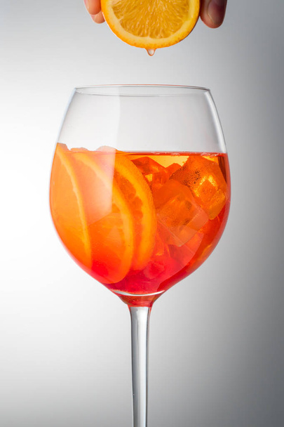 Summer refreshing faintly alcoholic cocktail Aperol spritz in a  - Φωτογραφία, εικόνα