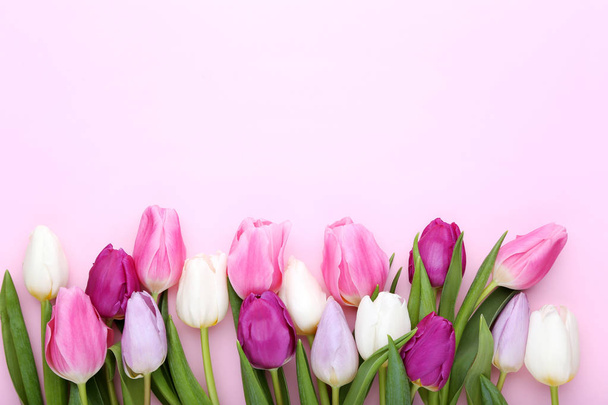 Bouquet of tulips on pink background - Zdjęcie, obraz