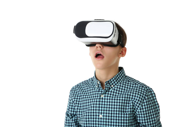 Young boy in virtual reality goggles on white background - Fotoğraf, Görsel