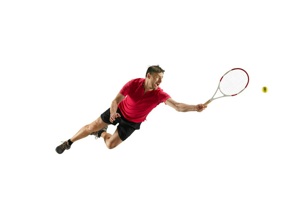 one caucasian man playing tennis player isolated on white background - 写真・画像
