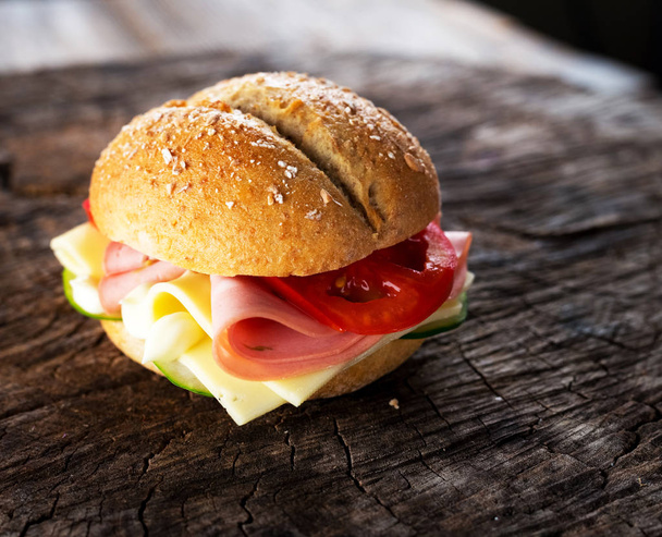 Sandwich with mozzarella, cheese and vegetables - Foto, Bild