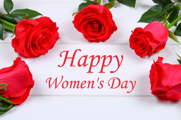 Happy woman's day. March 8. Roses on a white wooden table. - Foto, Imagen