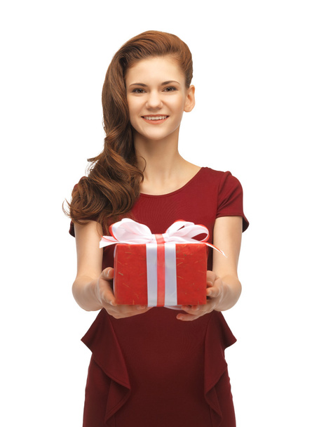 Teenage girl in red dress with gift box - Photo, Image