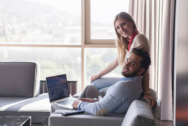 couple relaxing at  home using laptop computers - Photo, image