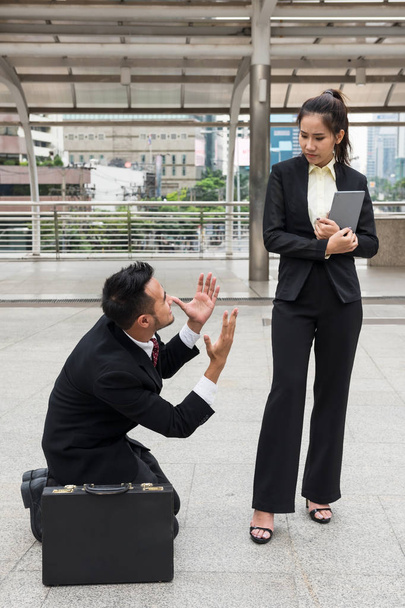 Stress Business man  kneel to woman bos - Photo, Image