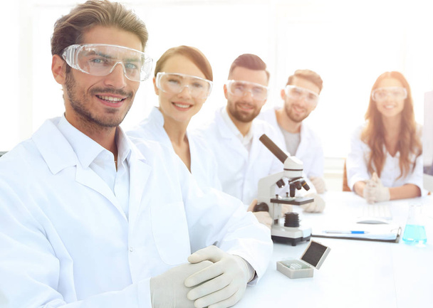 Male scientist and the team in the lab. - Fotó, kép