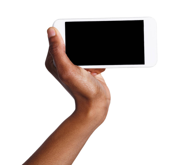 Mano negra sosteniendo teléfono inteligente móvil con pantalla en blanco
 - Foto, Imagen