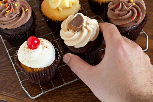 Persona Elegir un Cupcake
 - Foto, imagen
