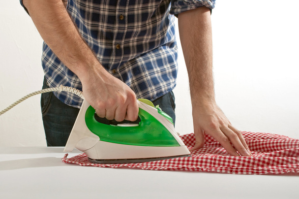 Man ironing - Фото, зображення