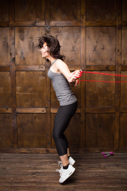 Girl jumping on skipping rope - Fotó, kép