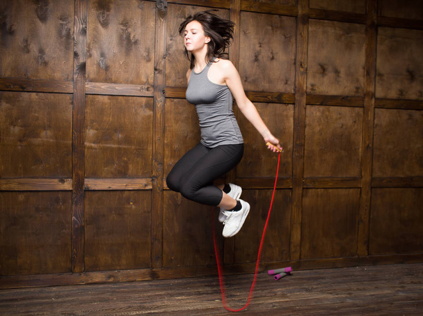 Girl jumping on skipping rope - Foto, imagen