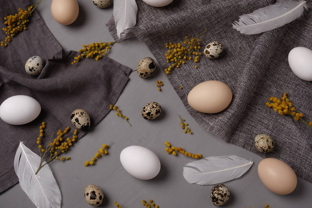 Eggs with flowers and decorative elements on concrete - Fotoğraf, Görsel