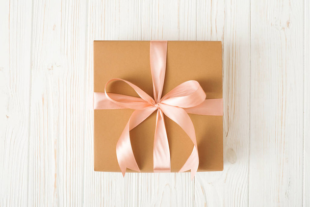 Top view of Gift box on white wood background. - Zdjęcie, obraz