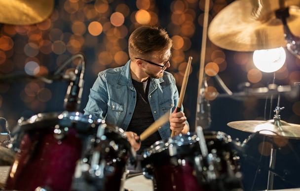 male musician playing drums and cymbals at concert - Photo, image