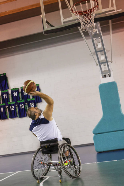 disabled sport men in action while playing indoor basketball - Фото, зображення