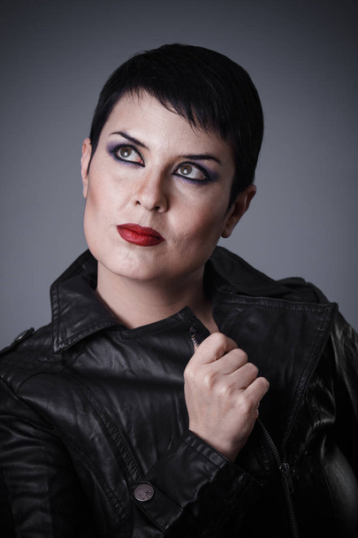Fashion, Brunette woman dressed in leather jacket, androgynous appearance, beauty and short hair - Фото, зображення