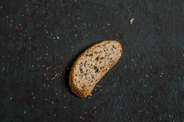 One slice of whole wheat bread with flaxseeds  - Photo, Image