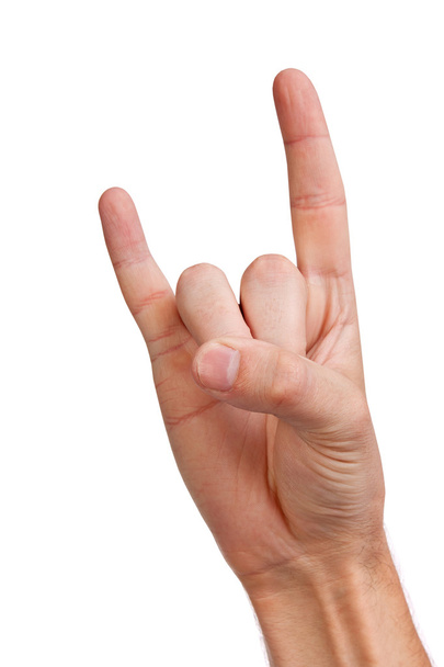 A man's hand giving the Rock and Roll sign - Photo, image