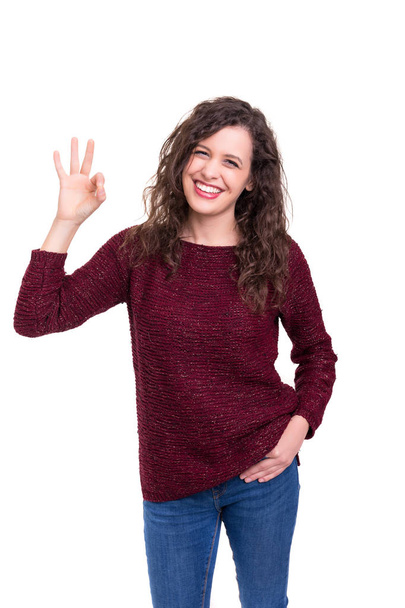 Young woman signaling ok isolated on white background - Zdjęcie, obraz