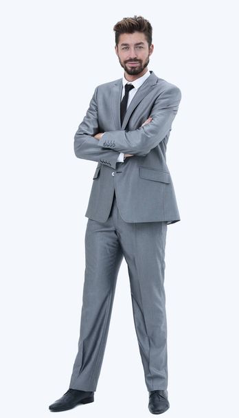 Full length of a young caucasian businessman with arms folded - Foto, Bild