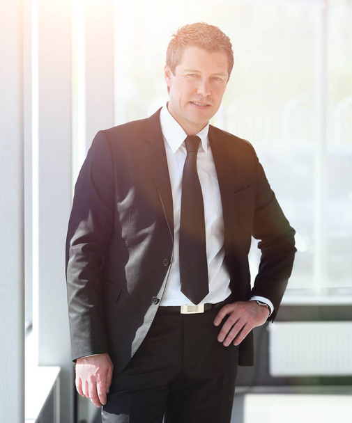 portrait of confident businessman on blurred background - Foto, Bild