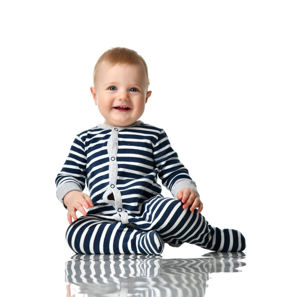 Infant child boy toddler in blue body with stripes sitting happy smiling - Φωτογραφία, εικόνα