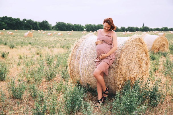 Beautiful pregnant woman in nature, outdoors.  - 写真・画像