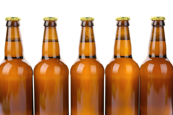 Glass bottles of beer isolated on white - 写真・画像