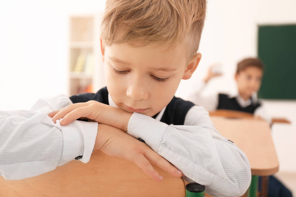 Bullied little boy in classroom - Fotografie, Obrázek