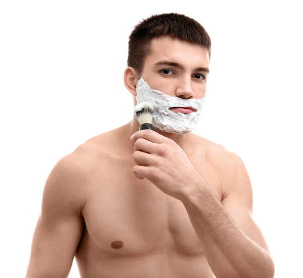 young man applying shaving foam - 写真・画像